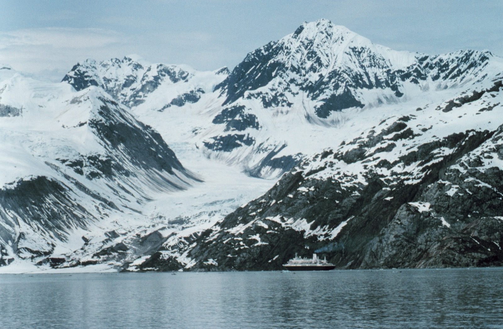 Cruise ship near towering Glacier Bay scenery in Alaska