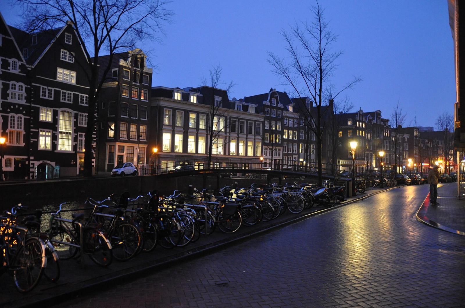 European canal street at dusk with historic buildings
